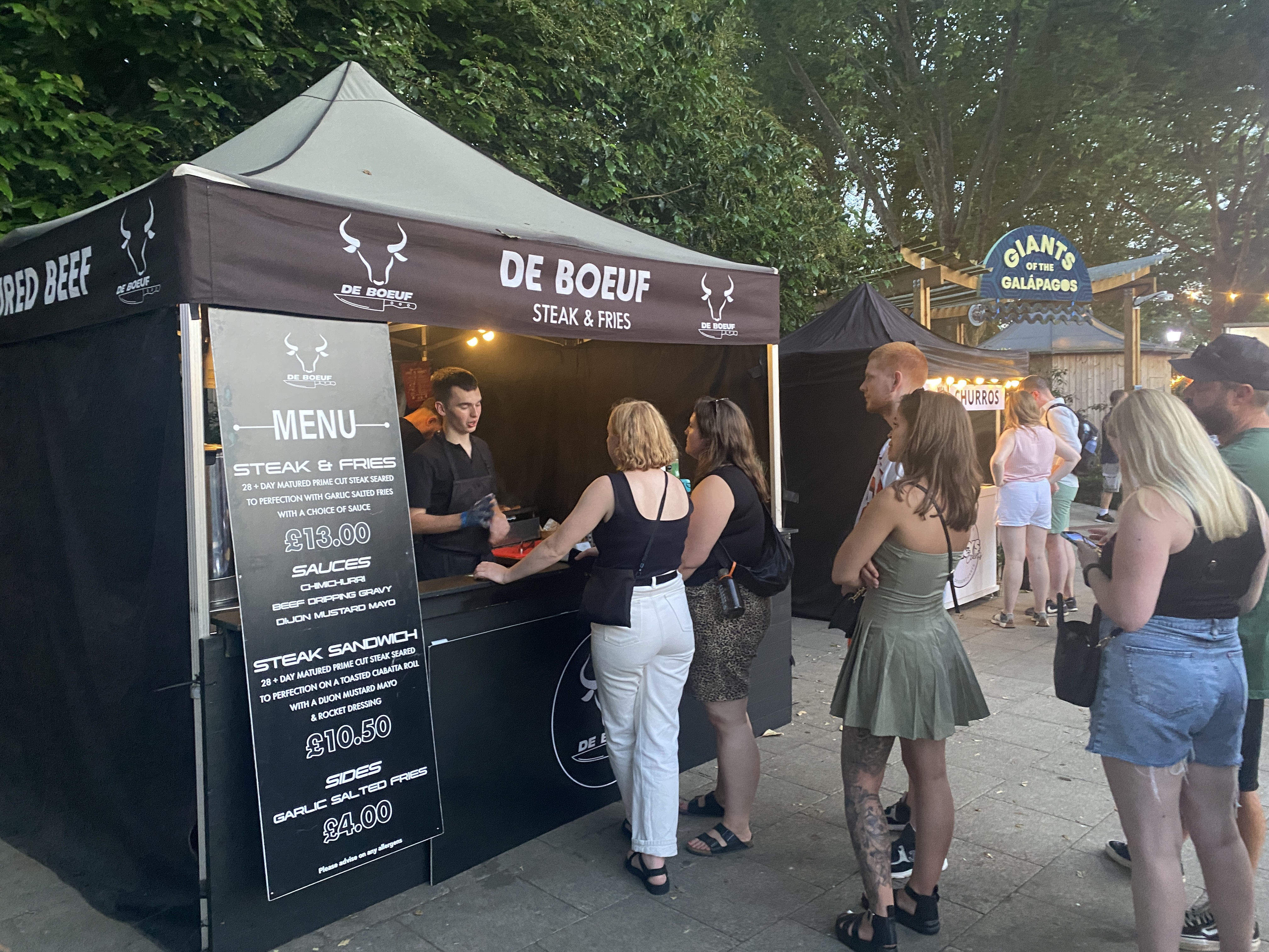 De Boeuf branded gazebo setup with queue
